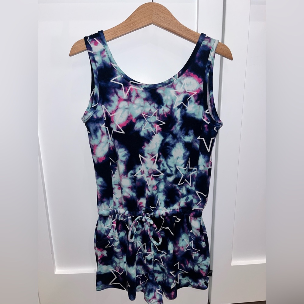 Pixie Lane blue, purple, navy tie dye with white outlined stars shorts romper.